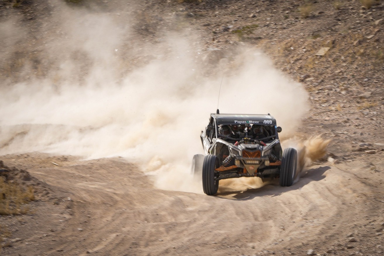 off-road vehicle racing in the desert