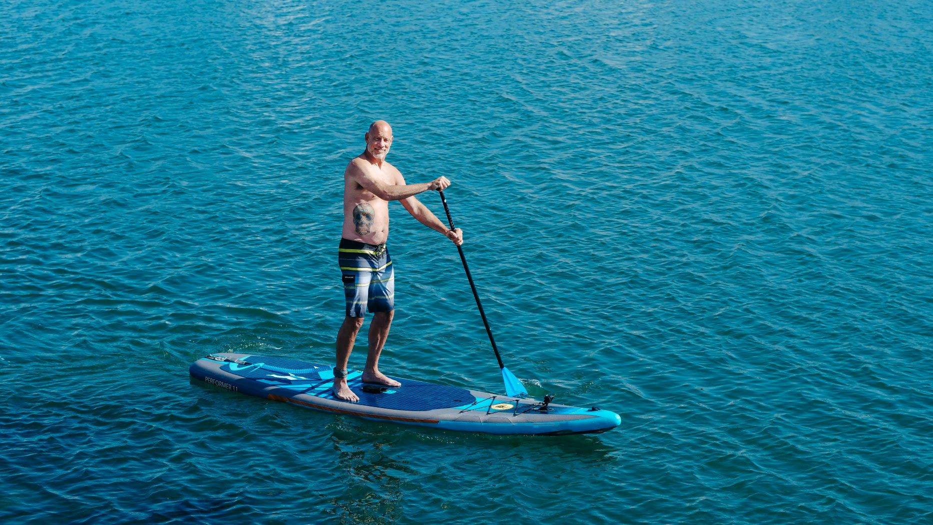 man paddle boarding on the Parker Keys